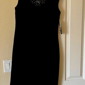 Brand new dress with tag . Gained weight and cannot take it back to the store